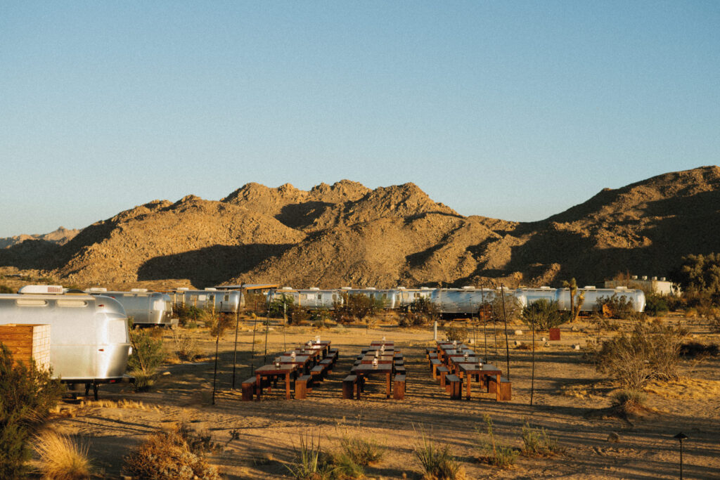 Outdoor Wedding Dinner at AutoCamp with Desert mountains in the distance